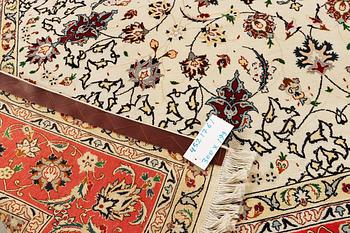 A Tabriz, part silk carpet, c. 300 x 199 cm.