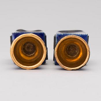 A pair of ceramic candlesticks signed Kaipiainen.