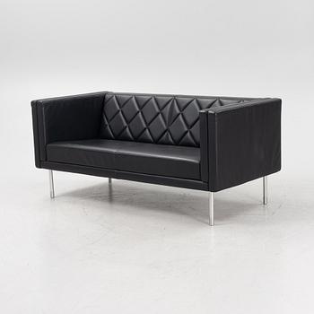 A leather upholstered sofa, 21st Century.