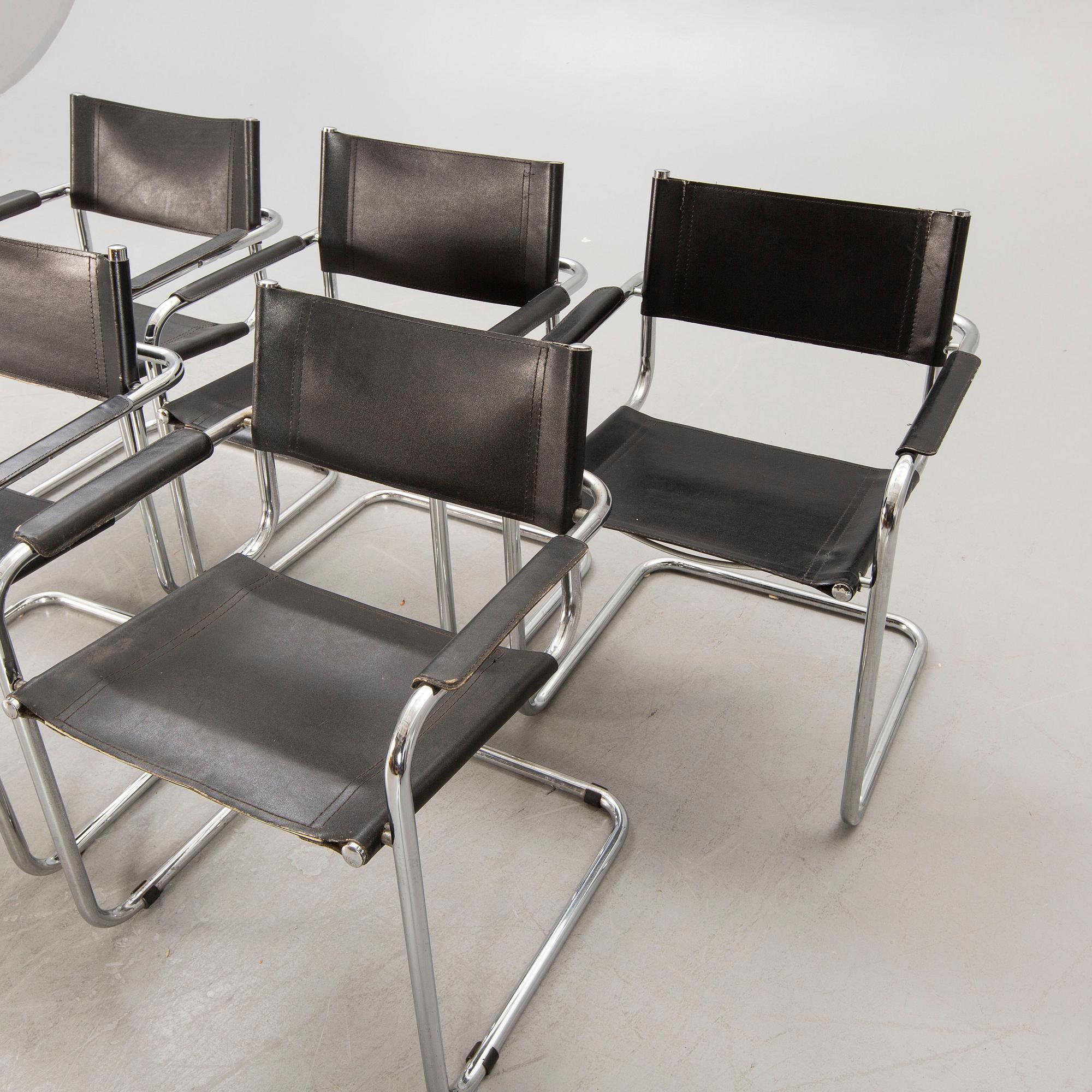A set of five similar Italian 1970s chrome and leather armchairs.