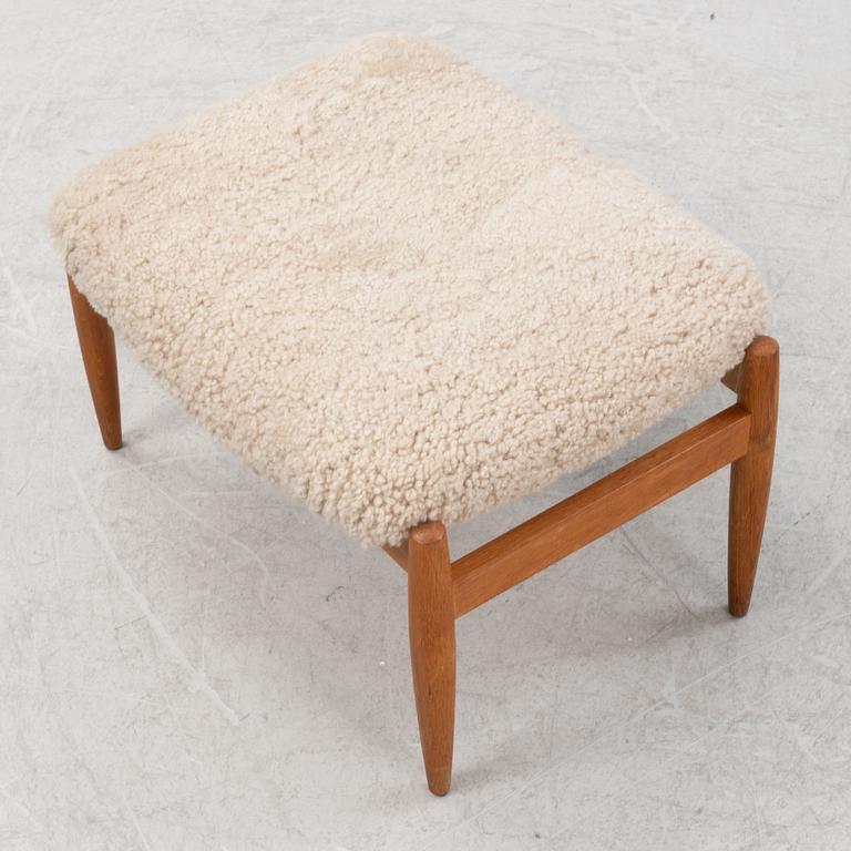 A sheepskin upholstered oak stool, second part of the 20th Century.