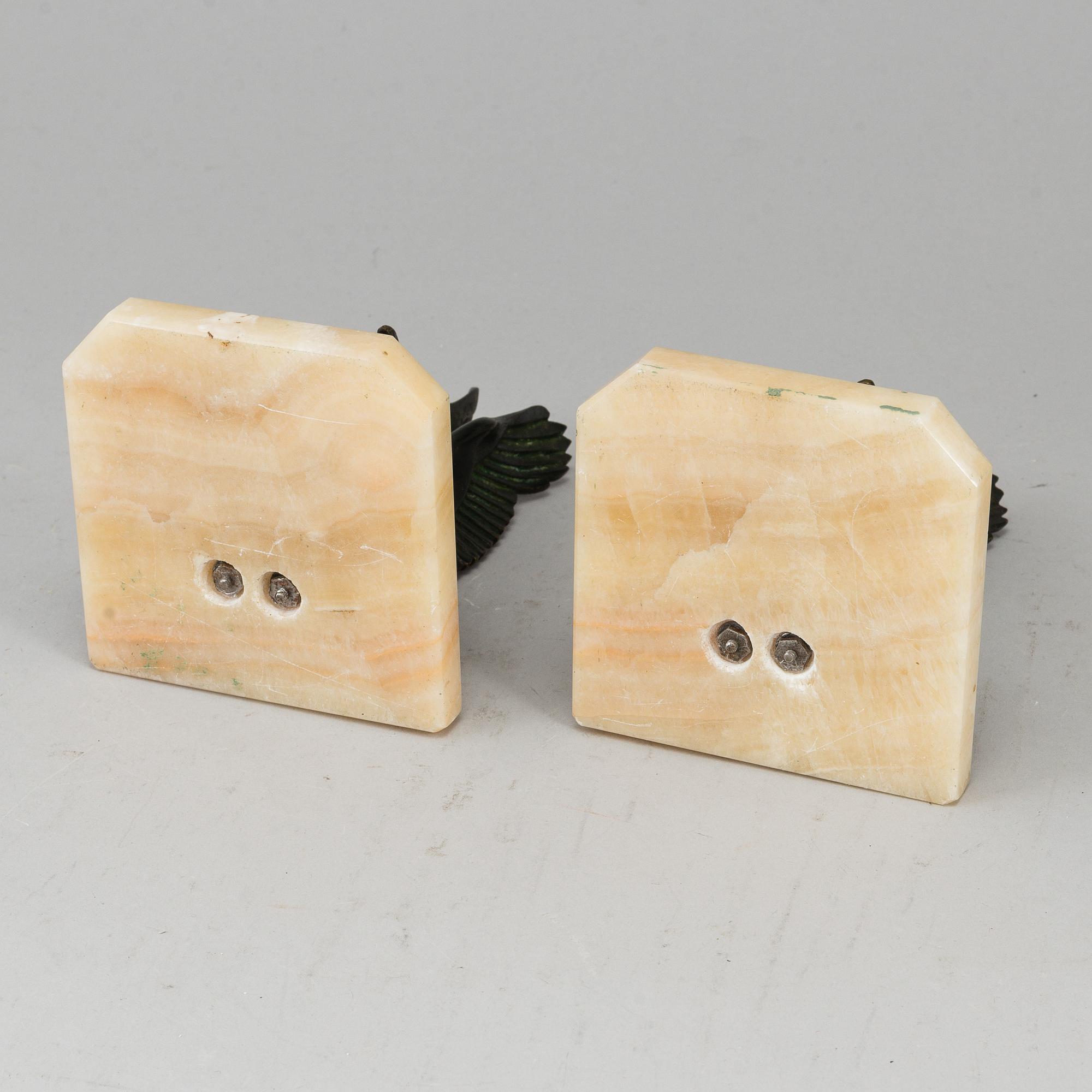 A pair of art déco marble and bronze book ends, 1930s.