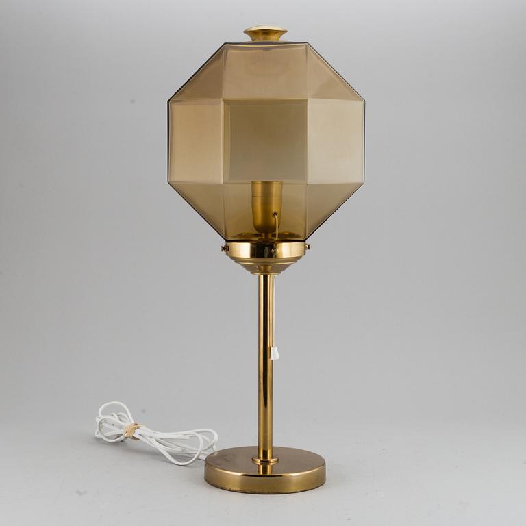 A decond half of the 20th Century brass and glass table light from Bergboms.