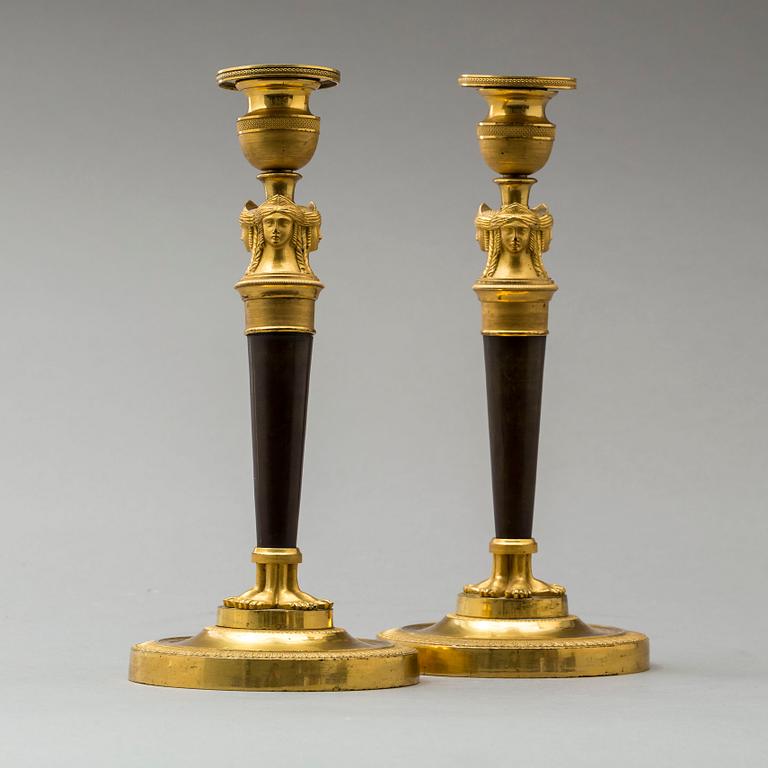 A pair of French Empire early 19th century candlesticks.