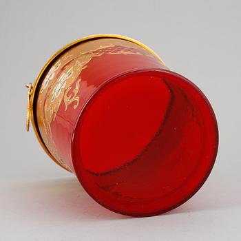 A red glass wine cooler.