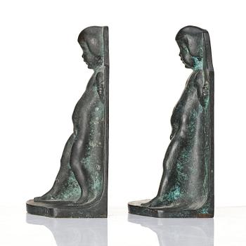 Axel Gute, a pair of Swedish Grace patinated bronze bookends, 1920s.