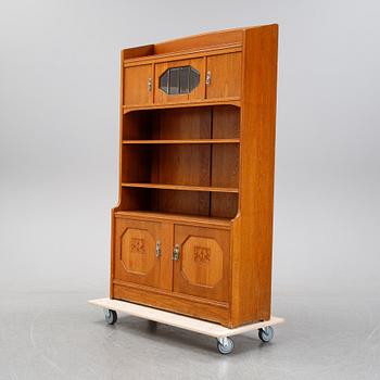 An oak cabinet and bookcase, early 20th Century.