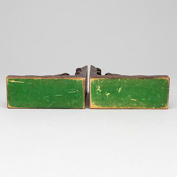 A pair of dark wood book ends, first half of the 20th century.