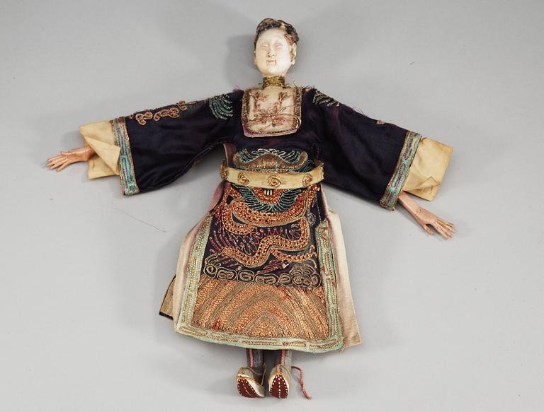 A pair of chinese bisque dolls with silk clothing, Qing dynasty.