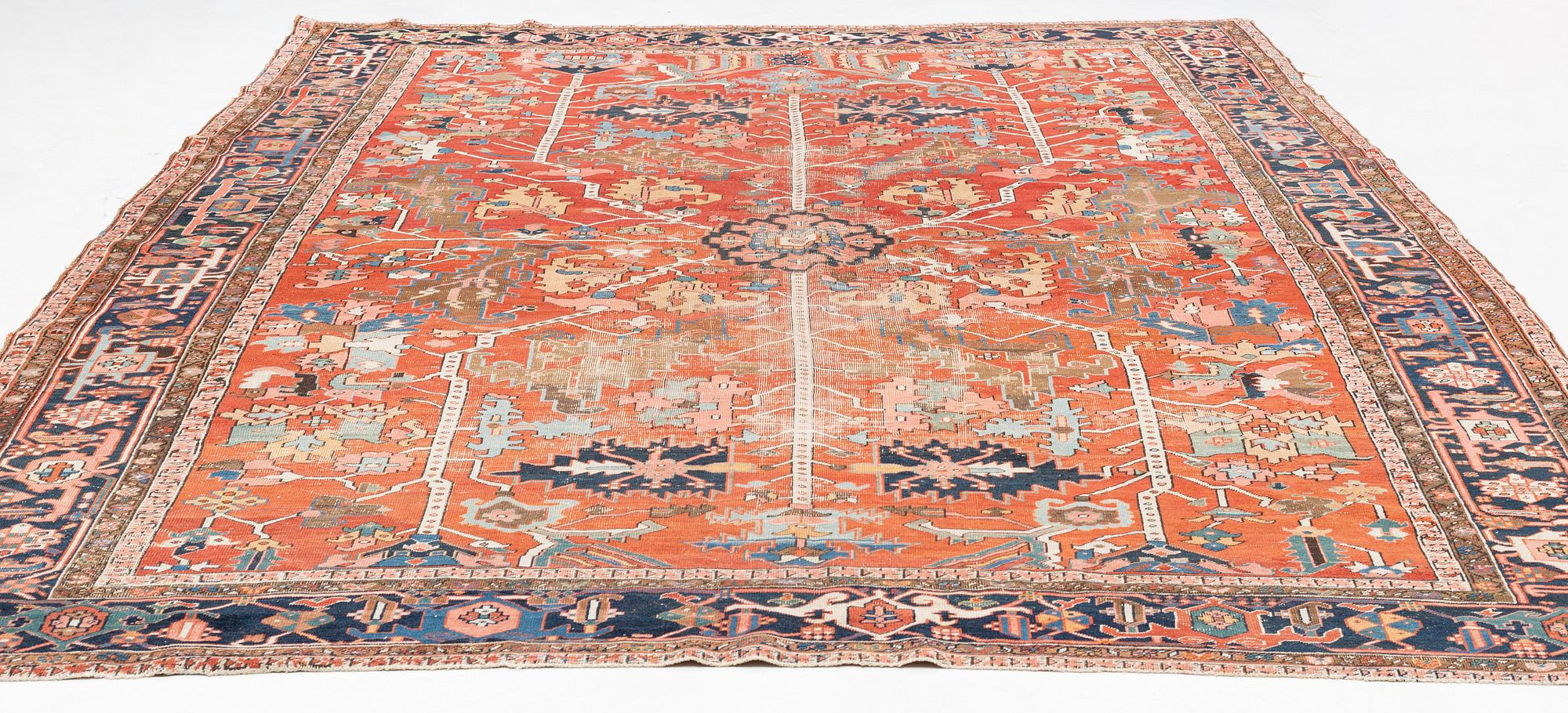 A antique Heriz carpet, ca 384 x 275 - 290 cm.
