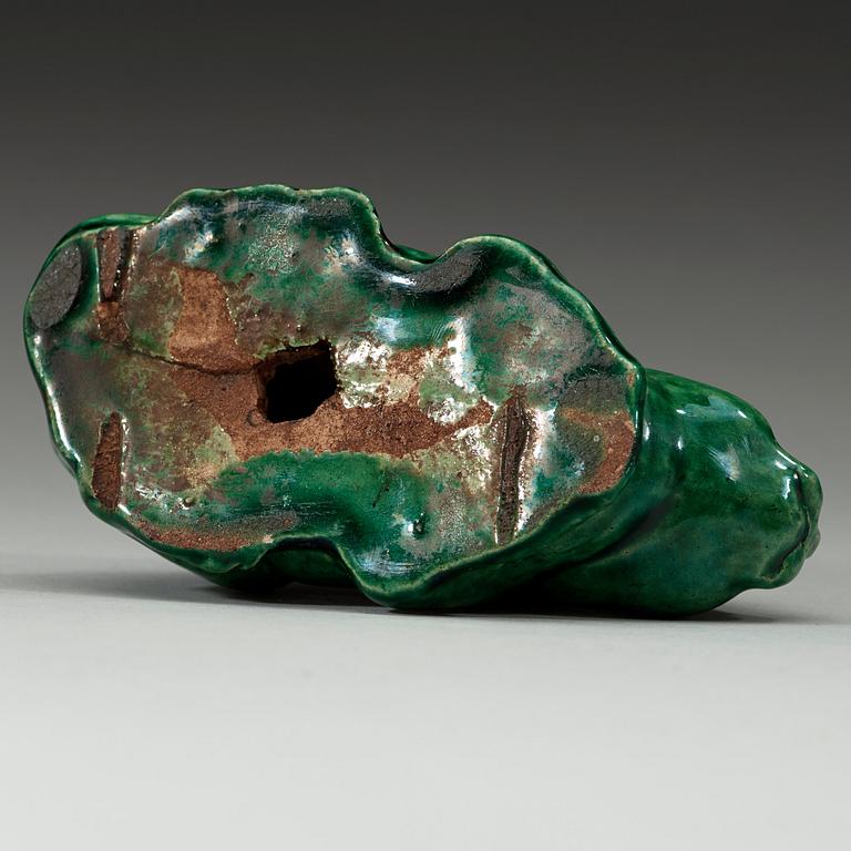 A green glazed figurine, Qing dynasty (1644-1912).