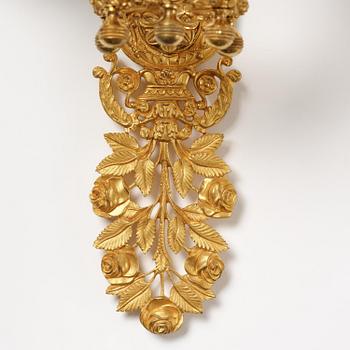 A pair of French 19th century gilt bronze five-light wall-lights.