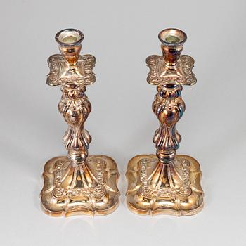 A pair of silver plated candlesticks.