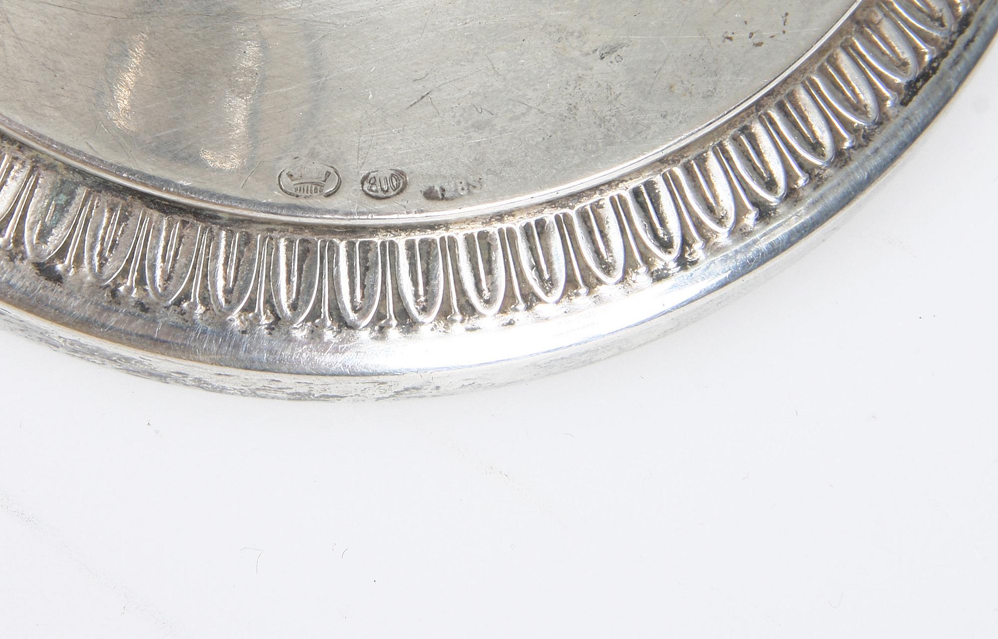 KOLONNLJUSSTAKAR, ett par, låghaltigt silver, 1900-tal.
