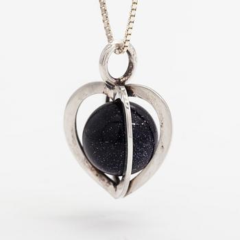Elis Kauppi, A silver necklace with a purple goldstone. Kupittaan kulta, Turku.