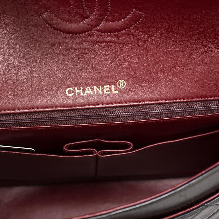 A "Double Flap bag" by Chanel.