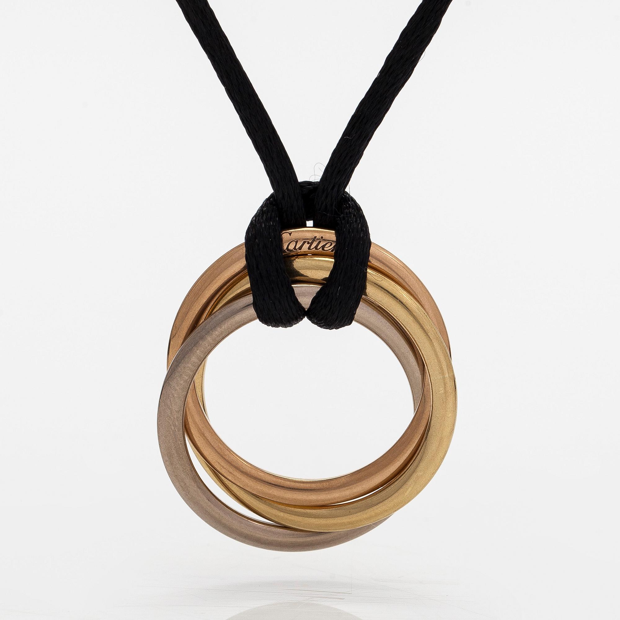 Cartier, necklace/pendant, "Trinity", 18K tricolour gold with black silk cord.