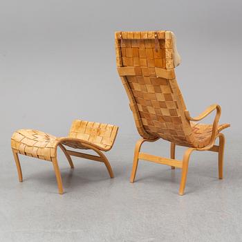 BRUNO MATHSSON, an easy chair and ottoman, Firma Karl Mathsson, Värnamo, 1978.