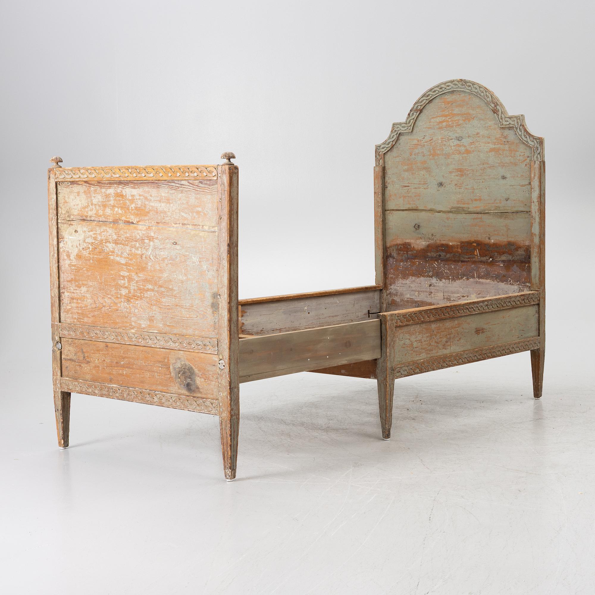 A Gustavian carved bedframe, late 18th century.