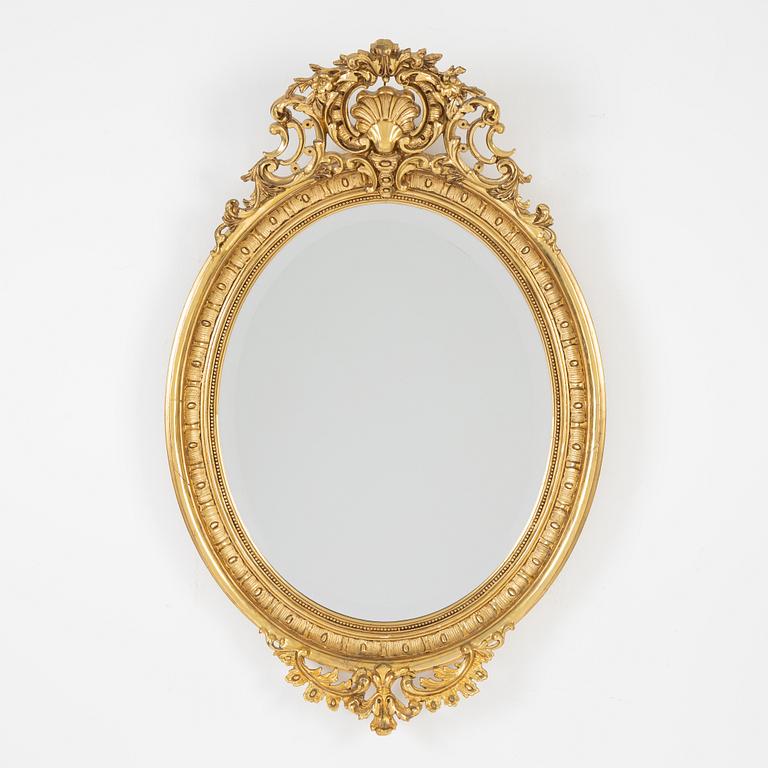 A Rococo style mirror, first half of the 20th Century.