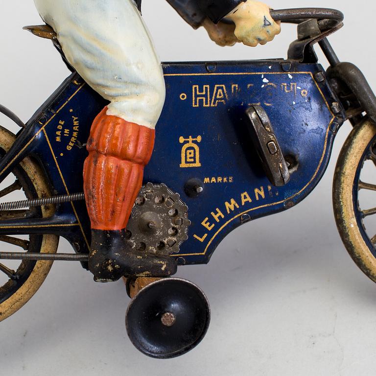 A partially hand painted tinplate Lehmann Halloh motorcycle, Germany. In production 1914-41.