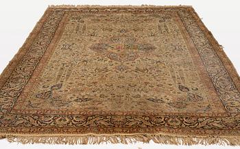 A semi-antique/old rug in mercerized cotton, ca 234 x 163 cm.