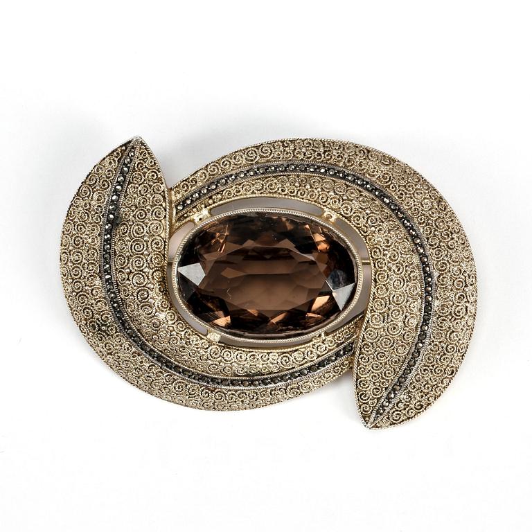 BROOCH, gilded sterling silver with smoky quartz and marcasite by Theodor Fahrner, Germany mid 20th century.