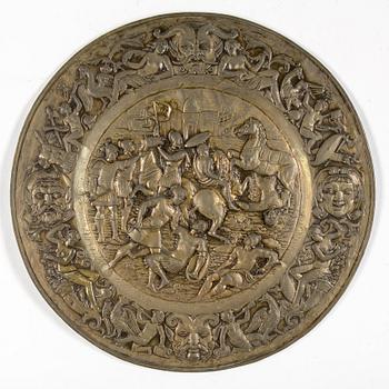 A BRASS WALL PLAQUE, 19th century.