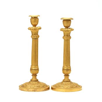 A pair of Empire early 19th century candlesticks.