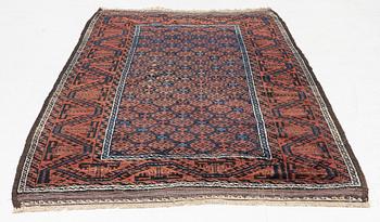 A semi-antique rug, baluch, including flat weave ca. 216 x 110 cm.