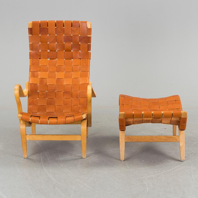 An easy chair with stool by Bruno Mathson.