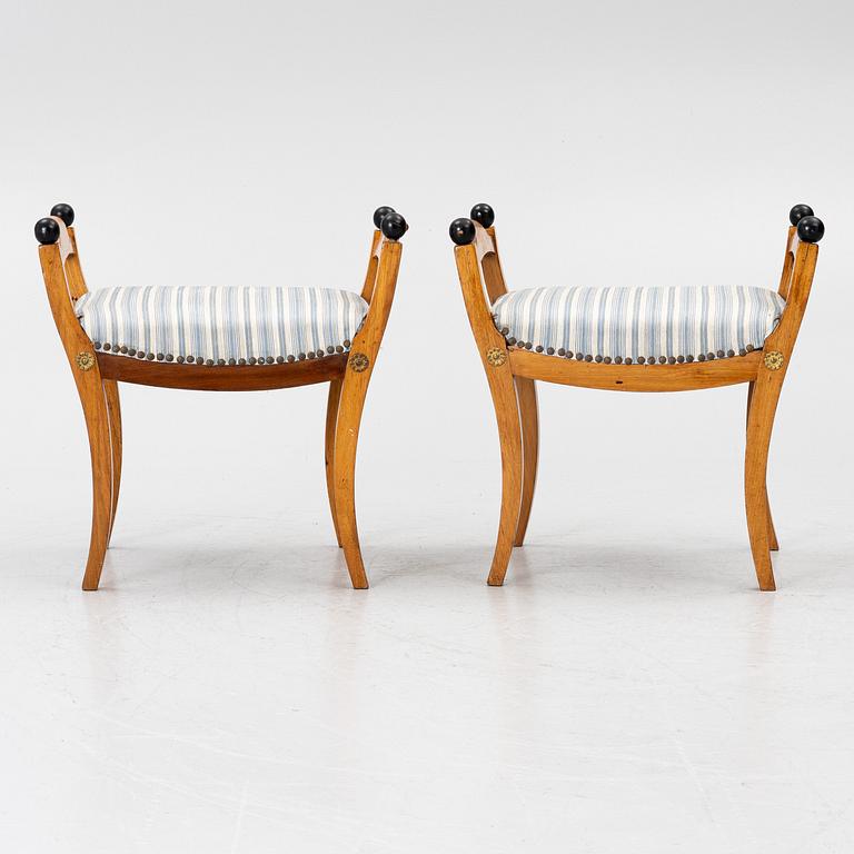 A pair of late Empire stools, mid-19th century.
