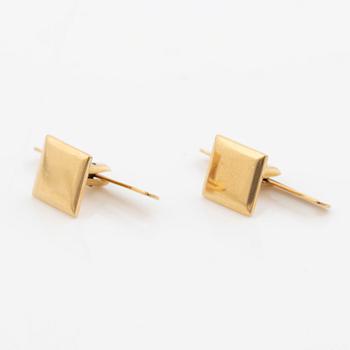 A pair of shirt studs 18K gold.