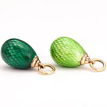 Two 14K gold pendants with enamel.