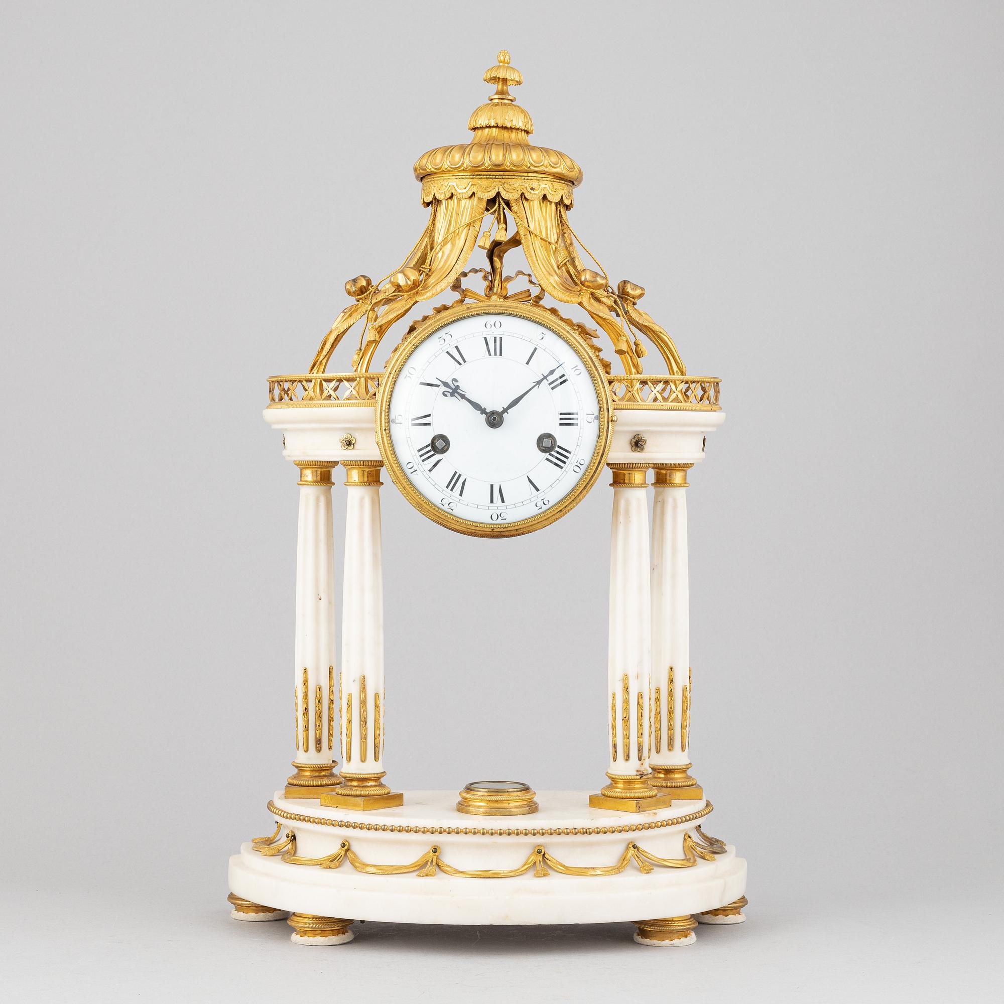 A Louis XVI marble and gilt bronze mantel clock, late 18th Century.