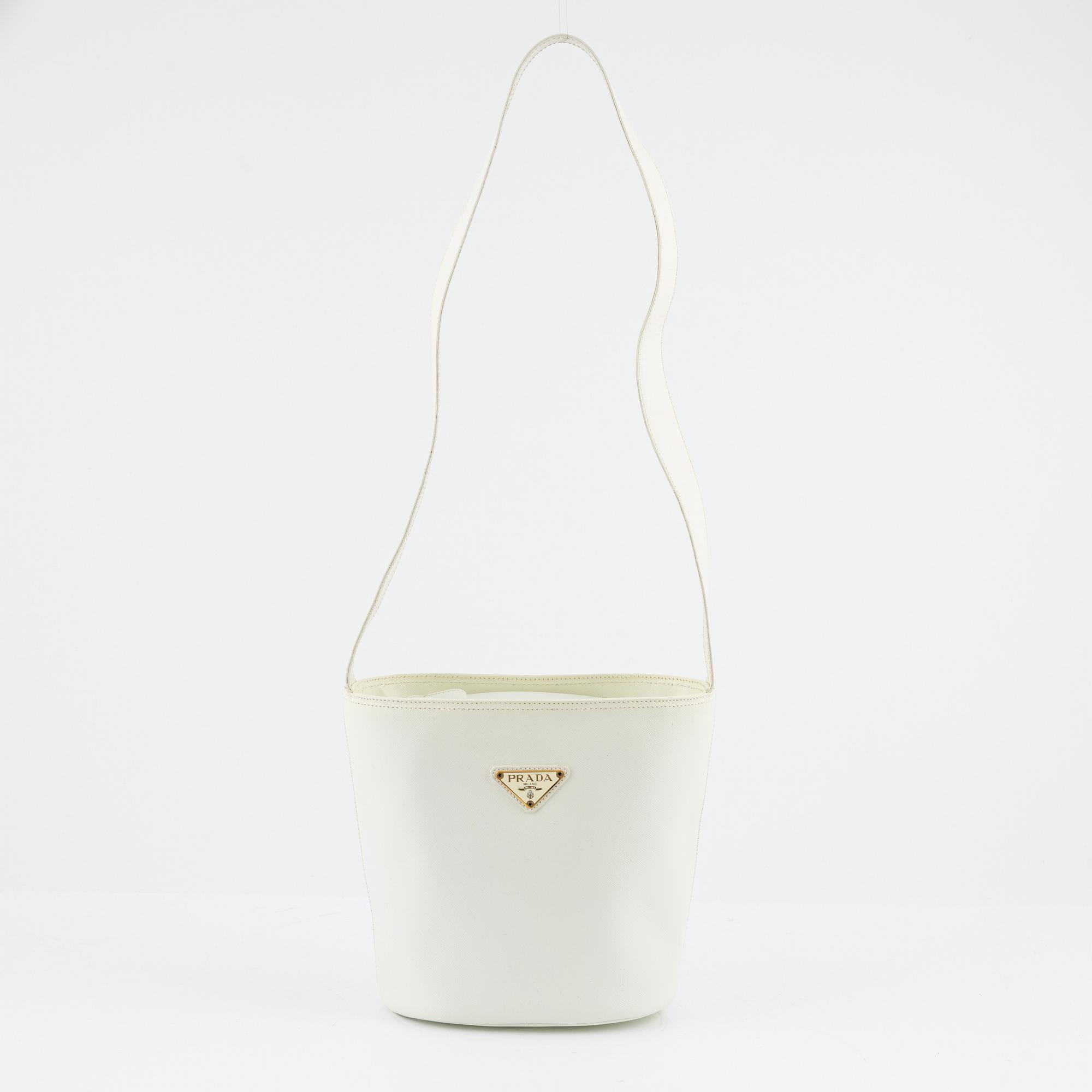 Prada, a white saffiano leather bag.