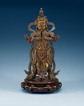 1258. A gilt bronze figure of a daoistic deity, late Ming dynasty, 17th Century.