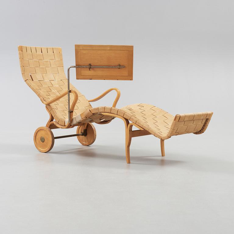 A Bruno Mathsson Swedish Modern chair with attached reading table, Karl Mathsson, Värnamo 1944.