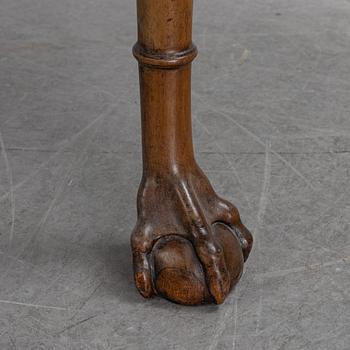 An English mahogany table, 19th Century.