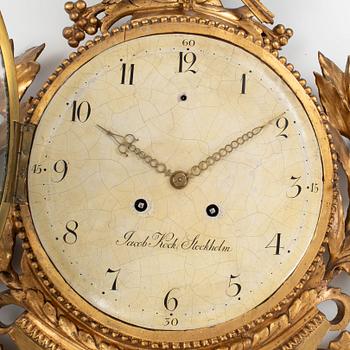 A late Gustavian carved and giltwood cartel clock by J. Kock (royal watchmaker, active 1762-1803).