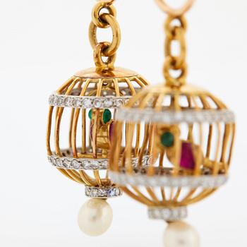 A pair of 18K gold birdcage earrings set with eight-cut diamonds, rubies and emeralds.