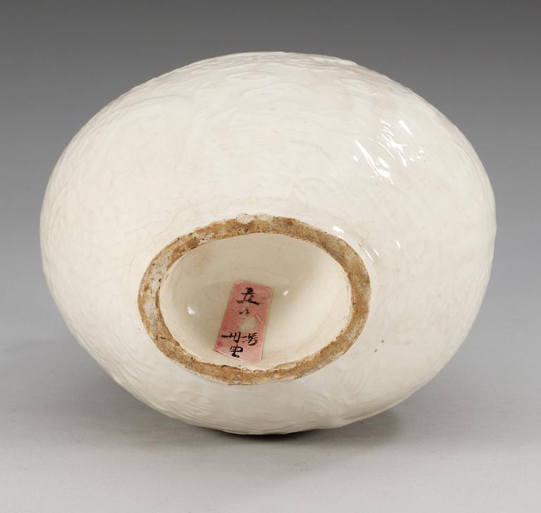 A Ding type soft paste pilgrim bottle vase, Ming dynasty (1368-1644).