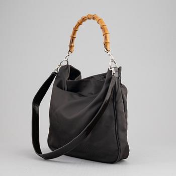 Gucci, a chocolate brown nylon handbag.