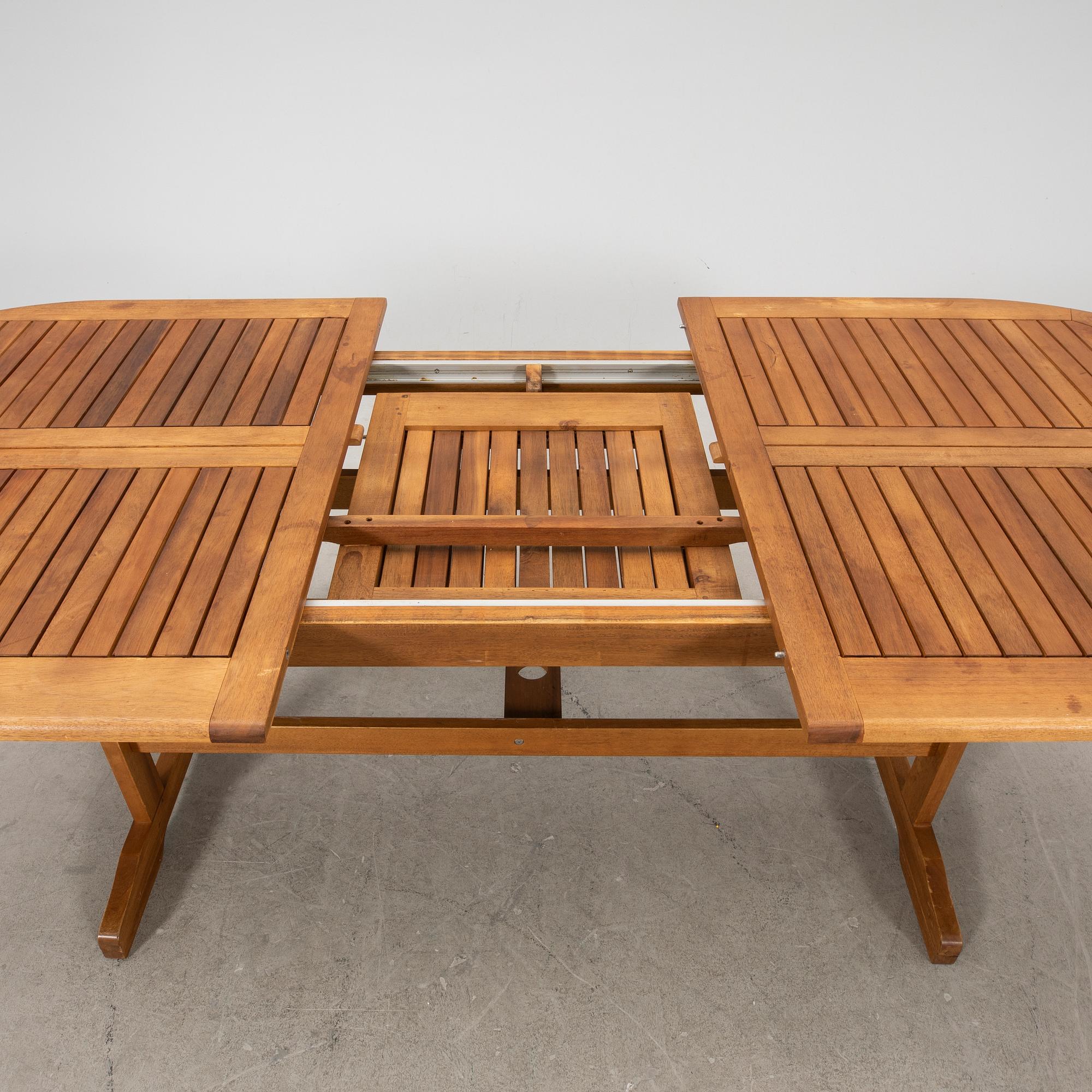 A 9 pcs stained teak garden suite by Brafab around 2000.