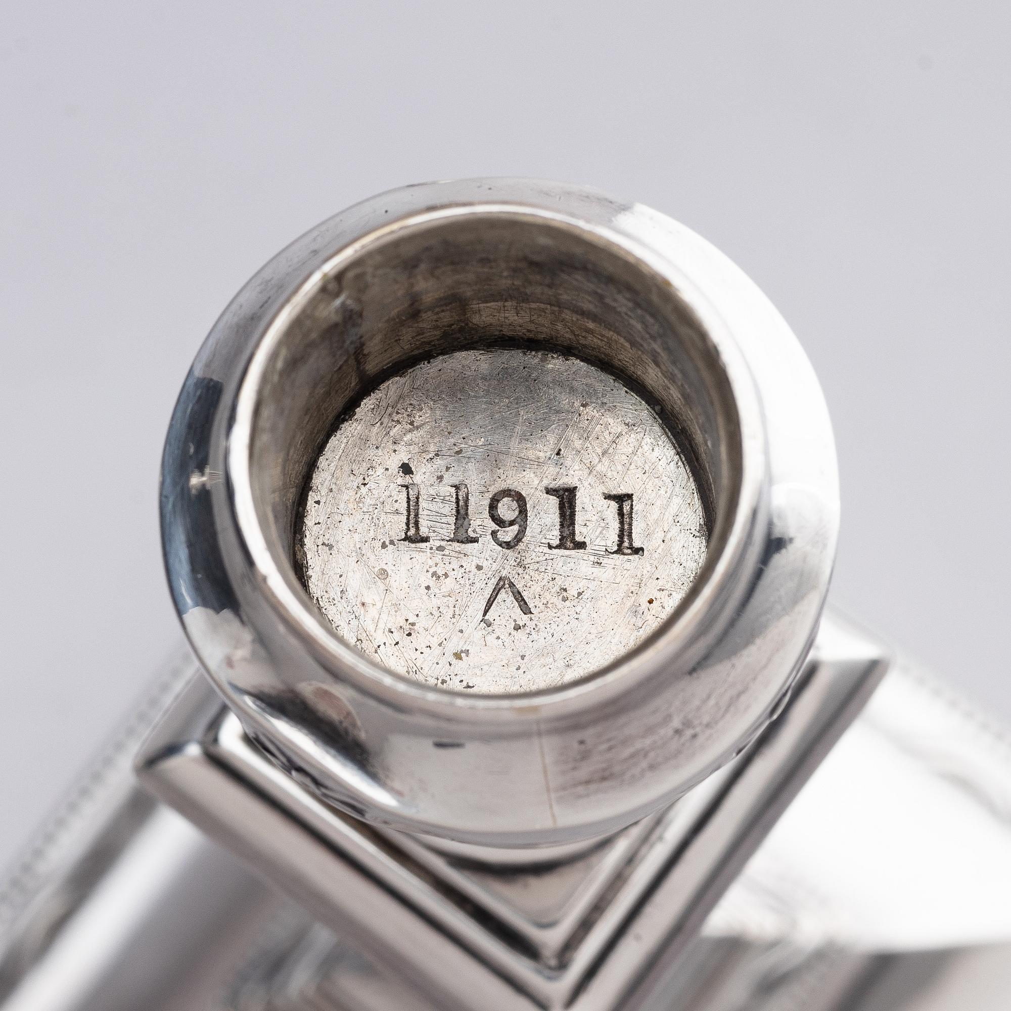 Four early 20th century silver candlesticks, marks of Hawksworth, Eyre & Co Ltd, Sheffield, England 1904-1906.
