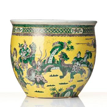 A large yellow ground famille verte bisquit jardiniere, Qing dynasty, 19th century. Marked 'Tack Loong Canton China'.