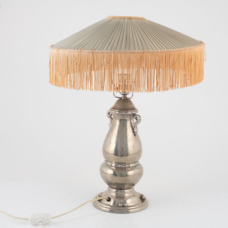 A pewter table lamp, first half of the 20th Century.