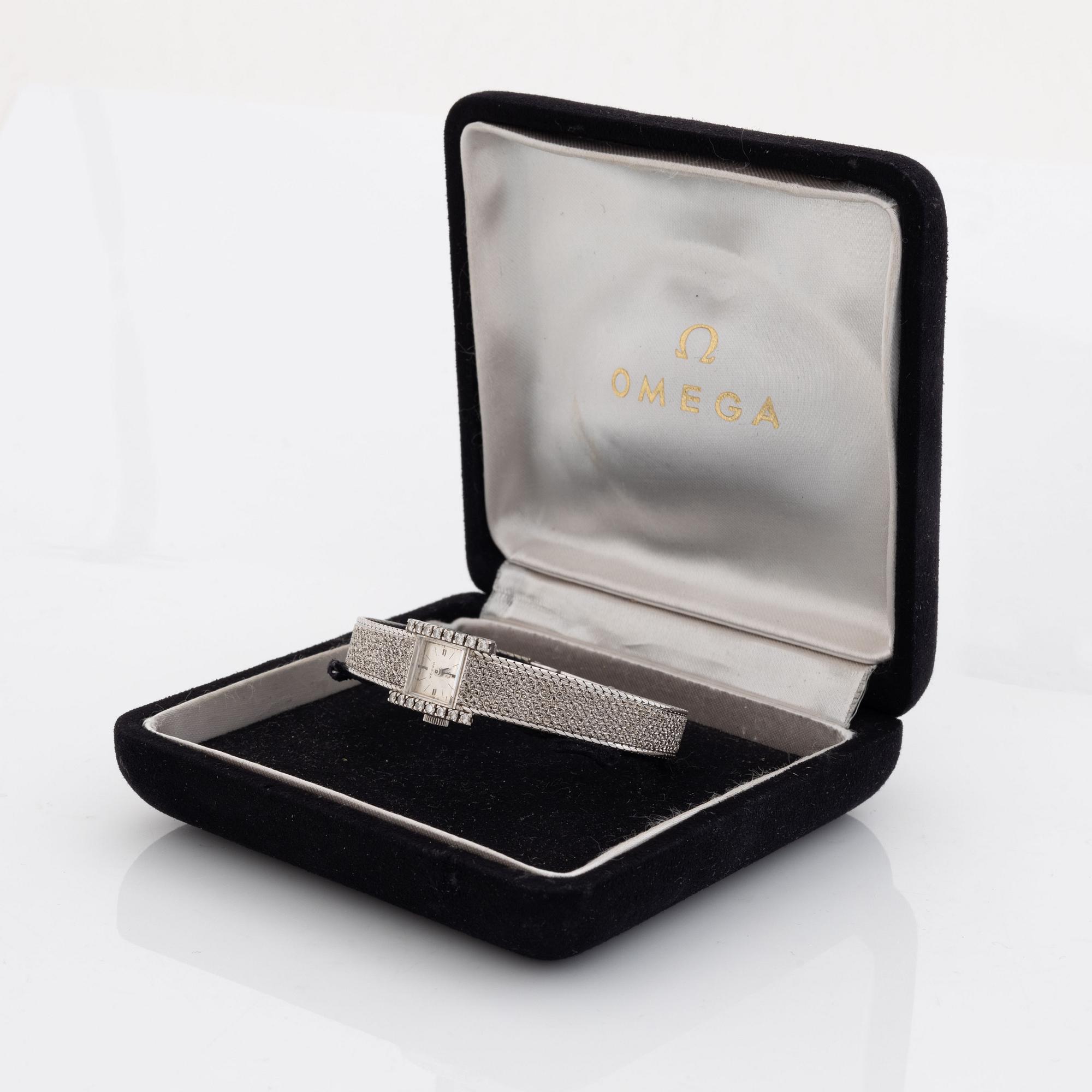 Omega, armbandsur, 18K vitguld med briljantslipade diamanter.