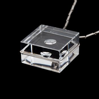 A glass pendant designed by Gunnar Cyrén and a silver necklace.