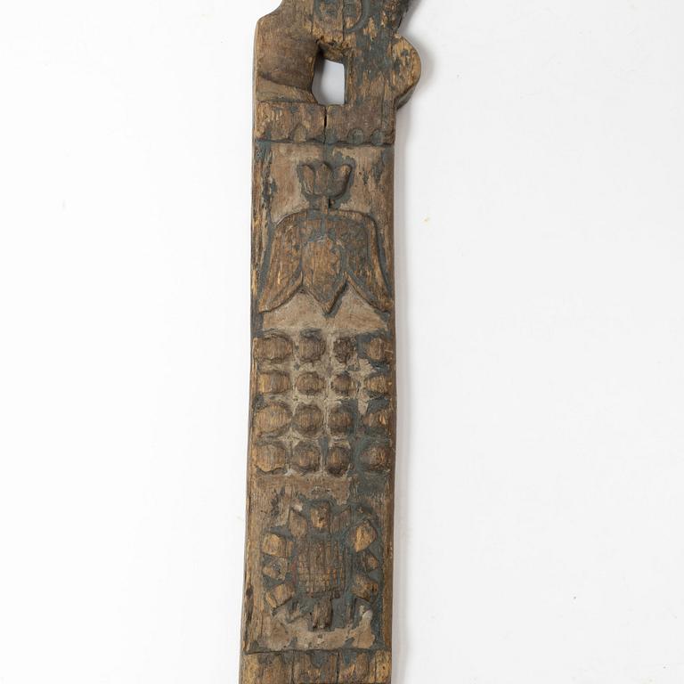 A Swedish carved and painted horse harness part, 18th century.